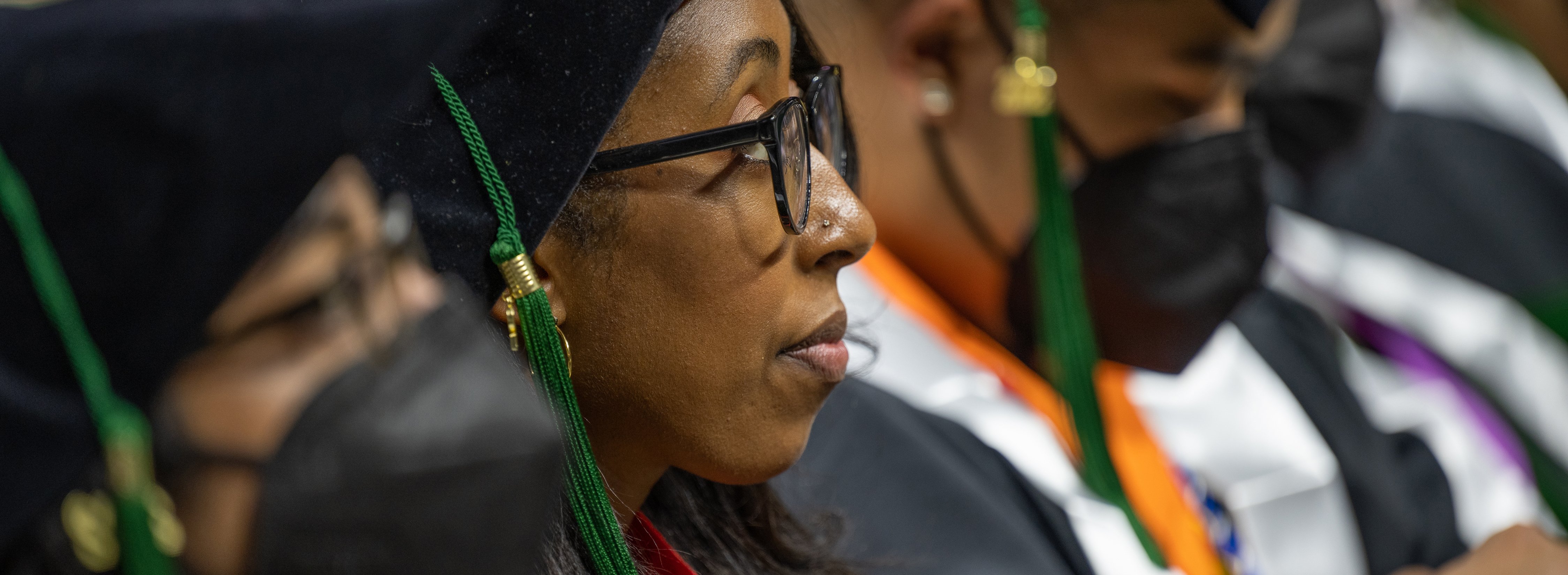 College of Human Medicine graduate looking whistfully into the distance.
